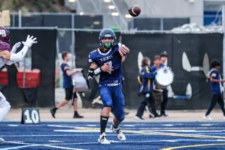 Quarter Wyatt Brown of Santa Monica throwing against Laguna Beach.