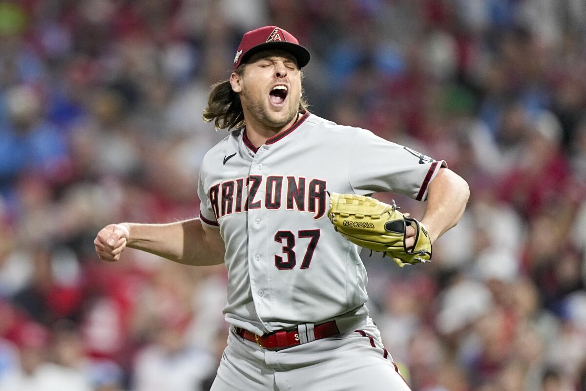 Arizona Diamondbacks relief pitcher Kevin Ginkel celebrates after the last out in the eighth inning on Oct. 24, 2023.
