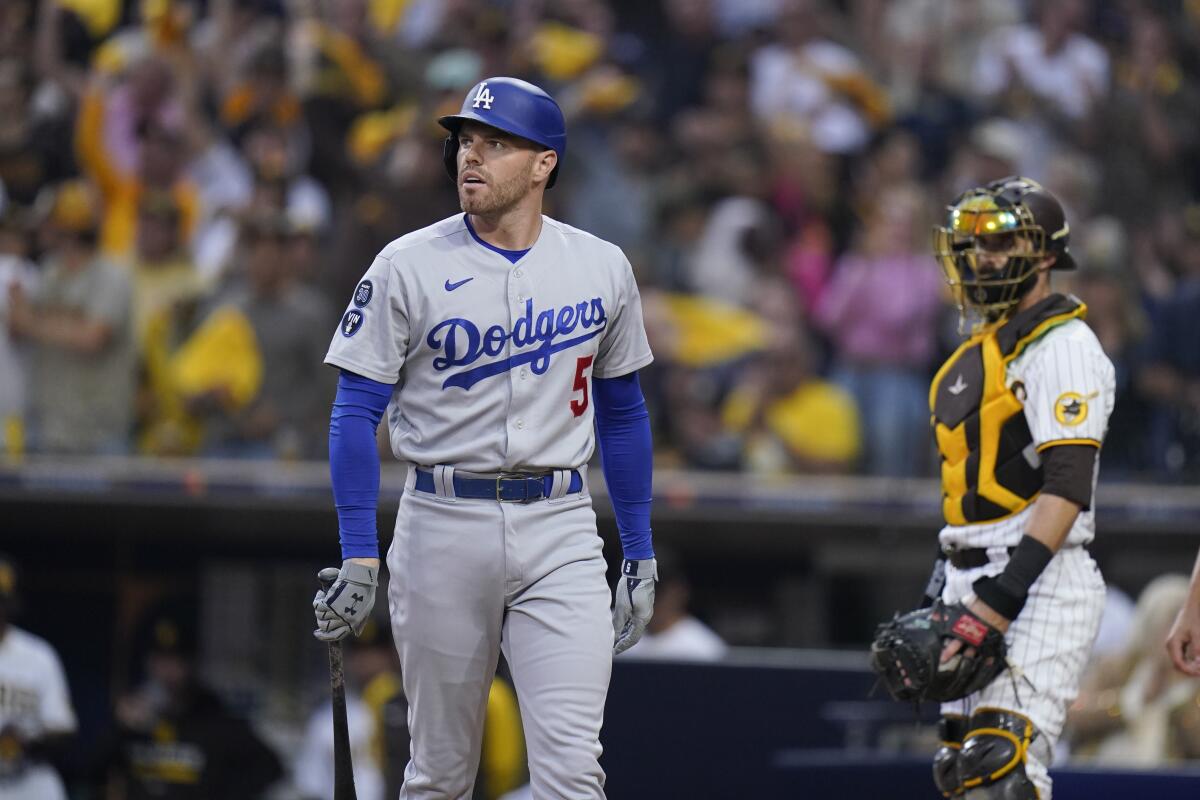 Dodgers first baseman Freddie Freeman walks back to the dugout after striking out in Game 3.