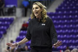 TCU head coach Raegan Pebley gestures on the sideline during an NCAA basketball game against Texas on Wednesday, Jan. 4, 2023, in Fort Worth, Texas. (AP Photo/Richard W. Rodriguez)