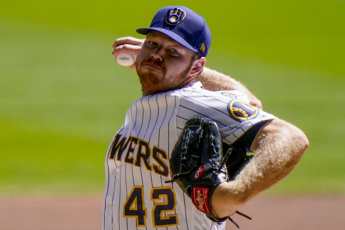 Milwaukee pitcher Brandon Woodruff delivers during a game.