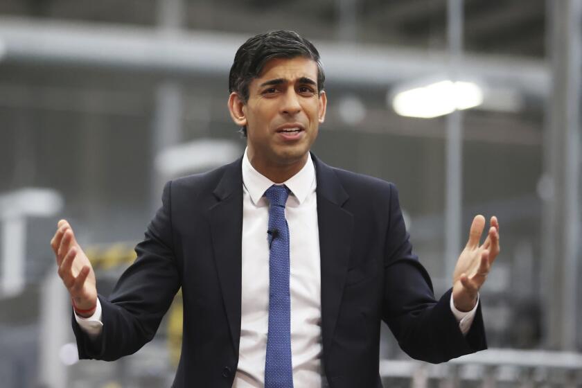 Britain's Prime Minister Rishi Sunak holds a Q&A session with local business leaders during a visit to Coca-Cola HBC in Lisburn, Northern Ireland, Tuesday Feb. 28, 2023. Sunak traveled to Belfast on Tuesday to sell his landmark agreement with the European Union to its toughest audience: Unionist politicians who fear post-Brexit trade rules are weakening Northern Ireland’s place in the United Kingdom. (Liam McBurney/Pool via AP)