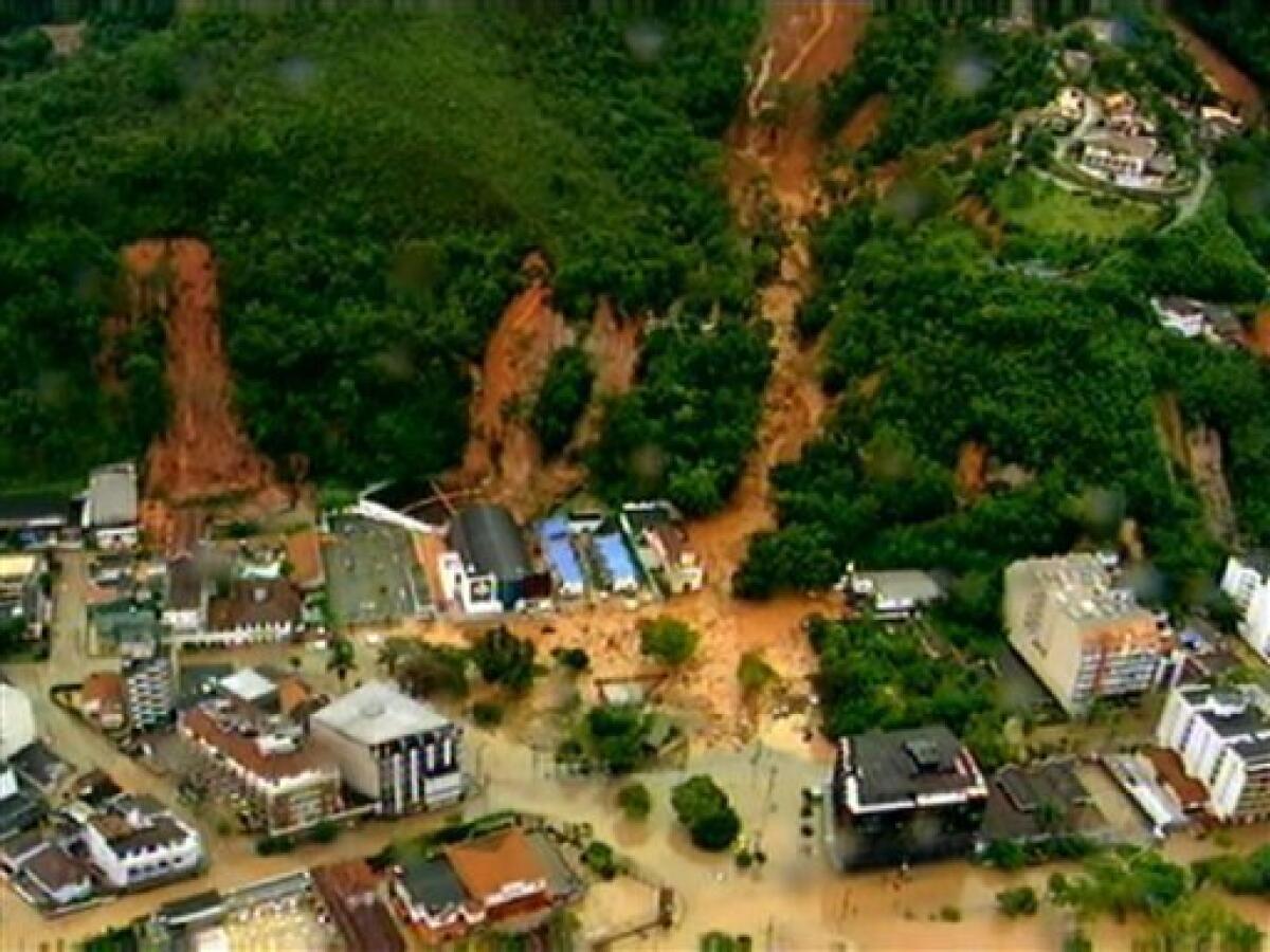 In this frame grab from video is seen an aerial view of a mudslide in Teresopolis, Brazil, Wednesday Jan. 12, 2011. Torrential rain tore through Rio de Janeiro's mountains, killing at least 64 people in 24 hours, the state's emergency rescue office said Wednesday. The death toll is expected to rise as firefighters reach remote valleys and steep mountainsides where neighborhoods were destroyed by mudslides and flooding, said Jorge Mario Sedlacek, the mayor of Teresopolis, a mountain town just north of Rio where at least 54 people died. About 1,000 there were left homeless. (AP Photo/TV Globo, Agencia O Globo)