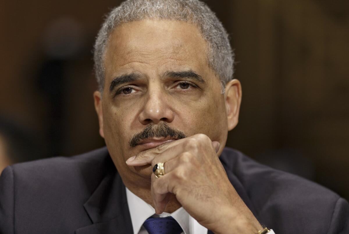 In a speech at Georgetown University, Attorney General Eric Holder noted that an estimated 5.8 million Americans are prohibited from voting because of felony convictions, and said that the impact of such exclusion on racial minorities was "disproportionate and unacceptable." Holder is seen above on Capitol Hill testifying before the Senate Judiciary Committee on Jan. 29.