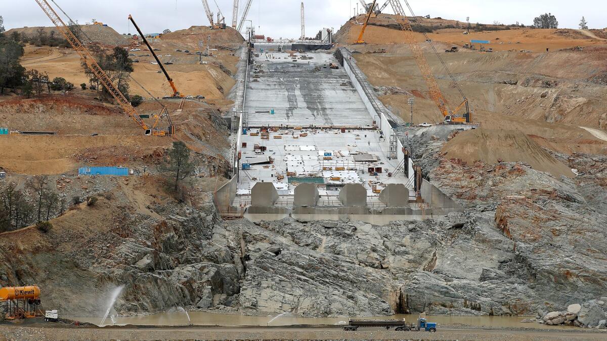 Construction crews repair the main spillway of the Oroville Dam.