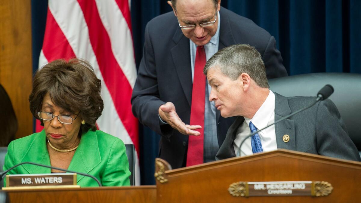 Rep. Maxine Waters (D-Los Angeles), left, awaits the start of the House Financial Service's Committee's Sept. 29 hearing investigating Wells Fargo's opening of unauthorized customer accounts.