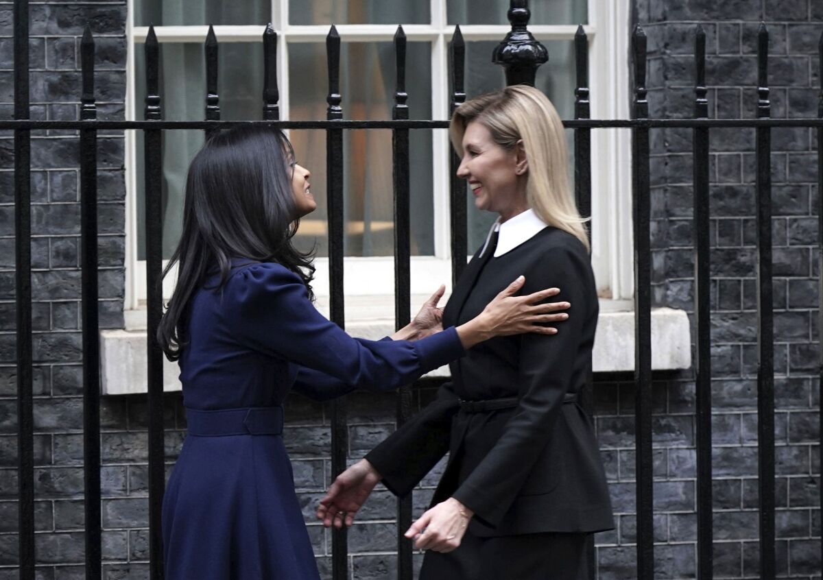 First Lady of Ukraine Olena Zelenska, right, is greeted by Rishi Sunak's wife Akshata Murty outside 10 Downing Street in London, Monday Nov. 28, 2022, during her visit to the UK. (Yui Mok/PA via AP)
