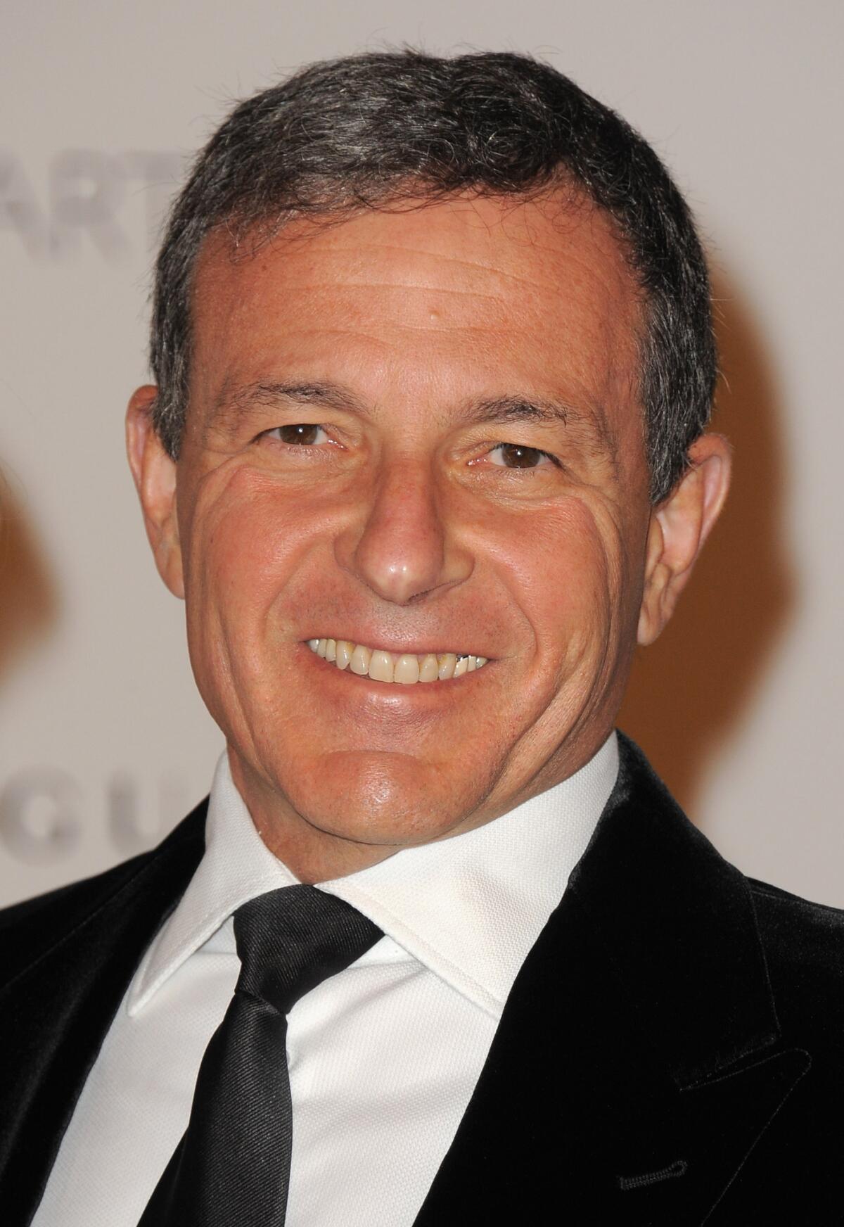 Walt Disney Co.'s Robert Iger will remain the company's chief executive through June 2016.