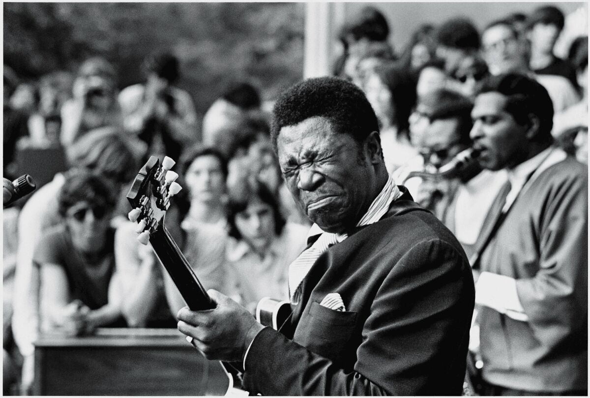 B.B. King, whose performances took him to small and large cities alike, plays the guitar at Central Park in New York in June 1969.