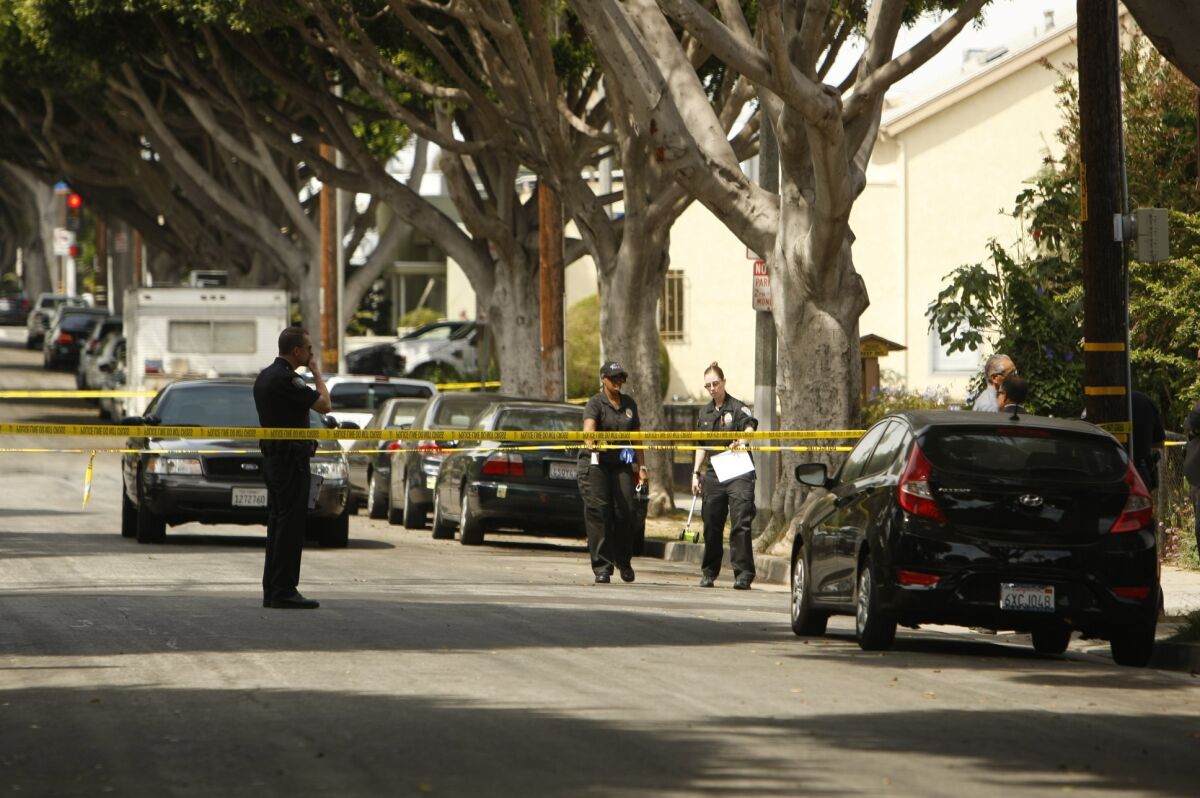 Police conduct their investigation in the 1500 block of Michigan Avenue in Santa Monica after two people were shot Tuesday.
