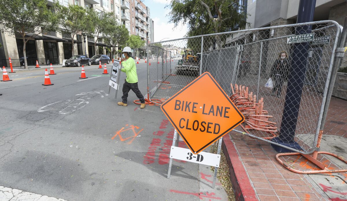 A work crew began construction at Market and 14th Streets of a promenade/ double sidewalk area in 2020 in San Diego.