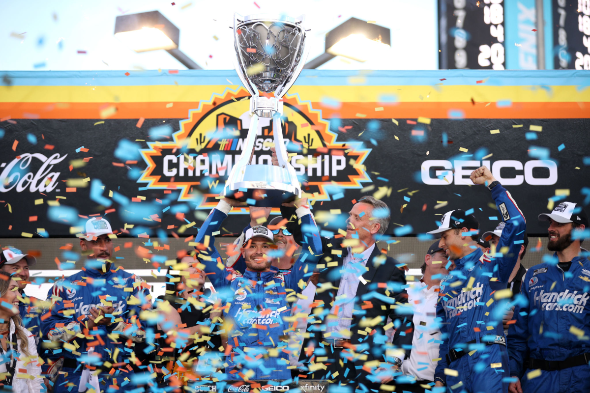 Kyle Larson celebrates in victory lane after winning the NASCAR Cup title at Phoenix Raceway on Sunday.