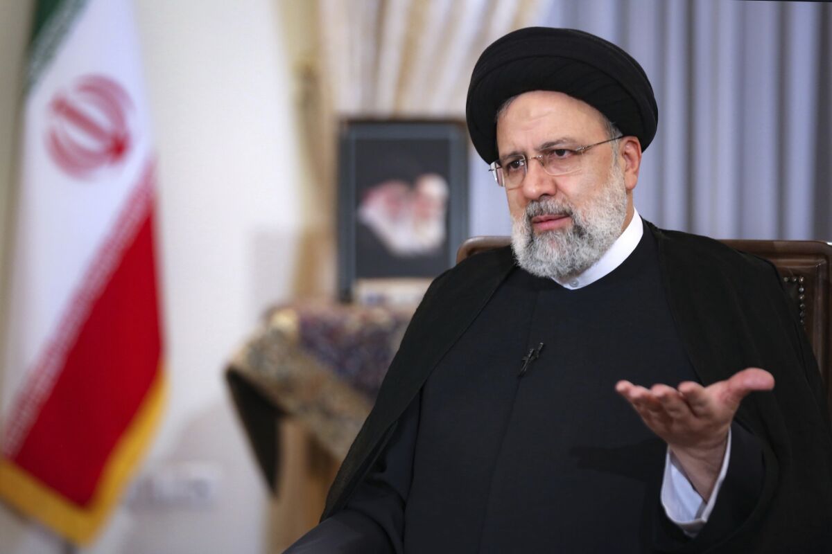 In this photo released by the official website of the office of the Iranian Presidency, President Ebrahim Raisi speaks in a live interview with state-run TV, at the presidency office in Tehran, Iran, Monday, May 9, 2022. Raisi said the country is exporting twice as much oil as when he took office in August, despite heavy sanctions on oil exports imposed by the U.S. (Iranian Presidency Office via AP)