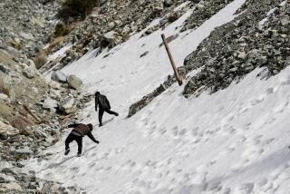 Mt. Baldy, CA, Thursday, February 16, 2023 - Hikers navigate a drainage culvert on Mt. Baldy. (Robert Gauthier/Los Angeles Times)