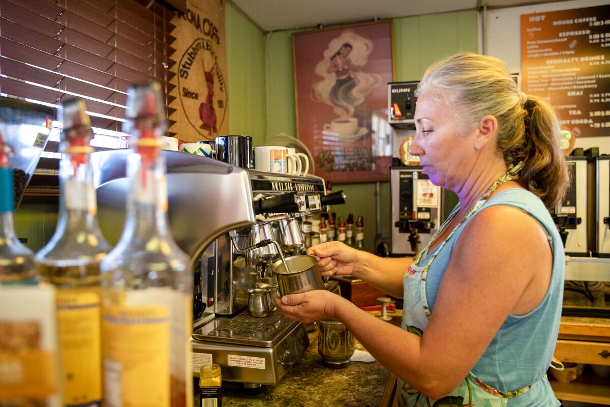 Tammy Stepp, owner of Kona Hut Coffee House, prepares a drink on Thursday.