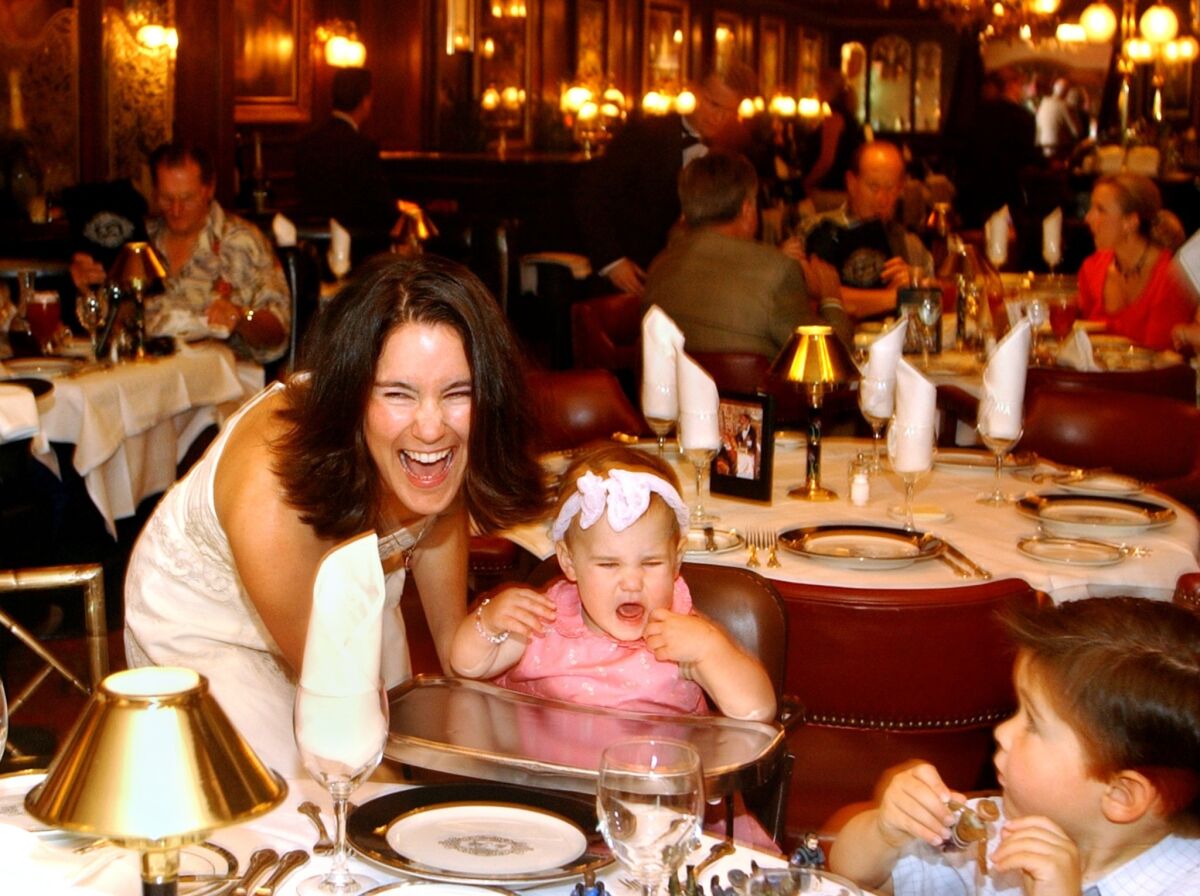 A mother and her kids enjoy Mother's Day brunch at a restaurant in Newport Beach.