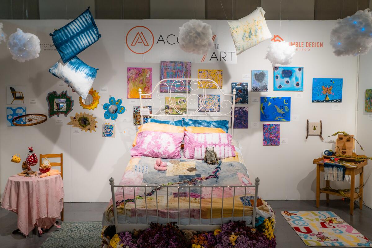 A bedroom art installation created by Humble Design for Monarch School, including art created by unhoused students.