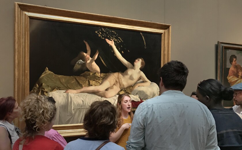 Kylie Holloway, who leads an unusual tour, tells the story of artist Artemisia Gentileschi in front of "Danae and the Shower of Gold," by Artemisia's father, Orazio Gentileschi, at the Getty Center.