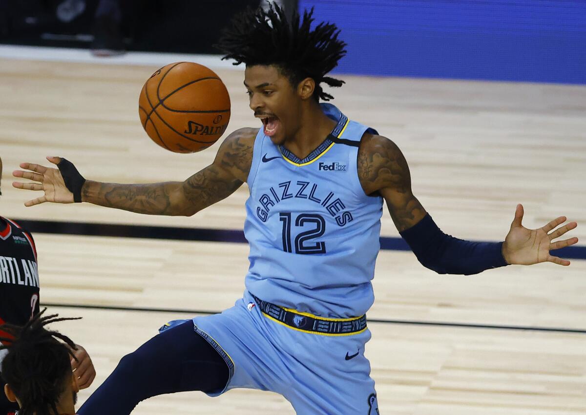 Ja Morant of the Memphis Grizzlies reacts to play against the