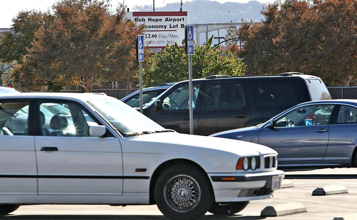 Cars sprinkle the parking area at Lot B at the Bob Hope Airport on Tuesday, November 4, 2013.