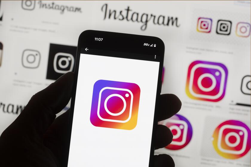 File - The Instagram logo is seen on a cell phone in Boston, USA, Oct. 14, 2022. Users of Meta's Facebook, Instagram, Threads and Messenger platforms are experiencing login issues in what appears to be a widespread outage. (AP Photo/Michael Dwyer, File)
