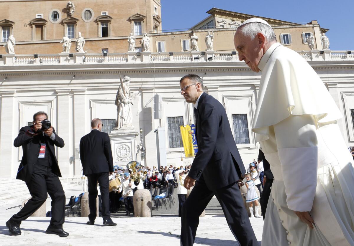 Pope Francis arrives for his weekly general audience in St. Peter's Square at the Vatican.