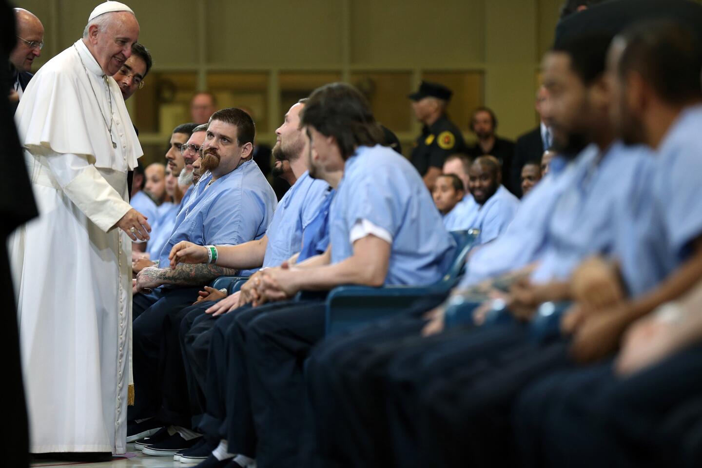 Pope Francis greets inmates during his visit to Curran Fromhold Correctional Facility in Philadelphia, Sunday, Sept. 27, 2015.