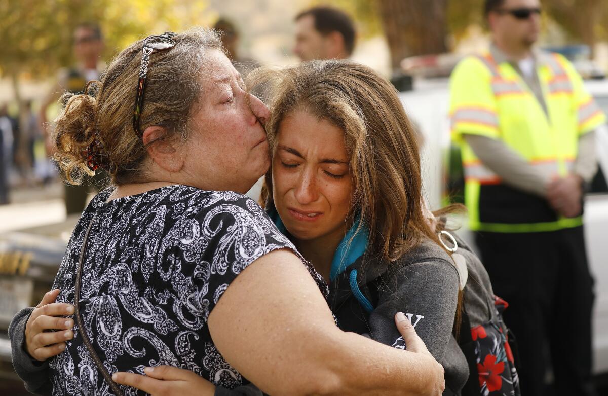 Rachel Ramirez, a 17-year-old senior at Saugus High School, gets a hug from her mother, Cheryl Ramirez, as they are reunited at a nearby park after a student opened fire on the Santa Clarita campus early Thursday.