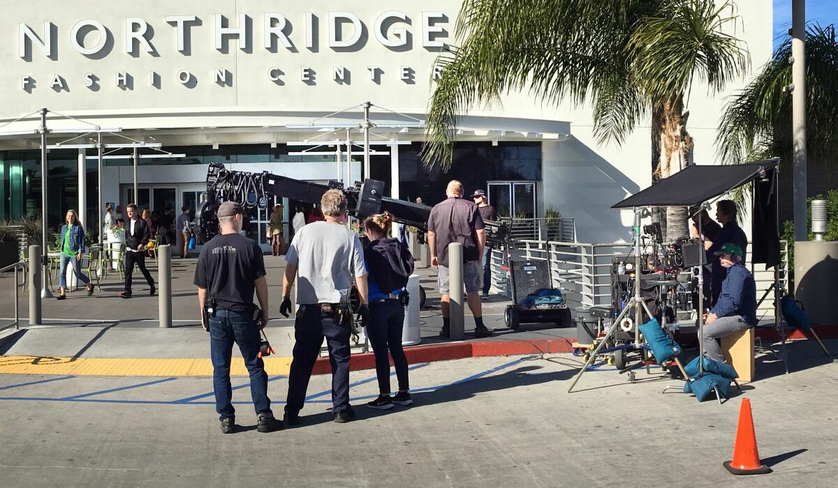 Crews film a scene for the Netflix movie “The Prom” at the Northridge Fashion Center in the San Fernando Valley. It filmed this year before the coronavirus pandemic shut down production.