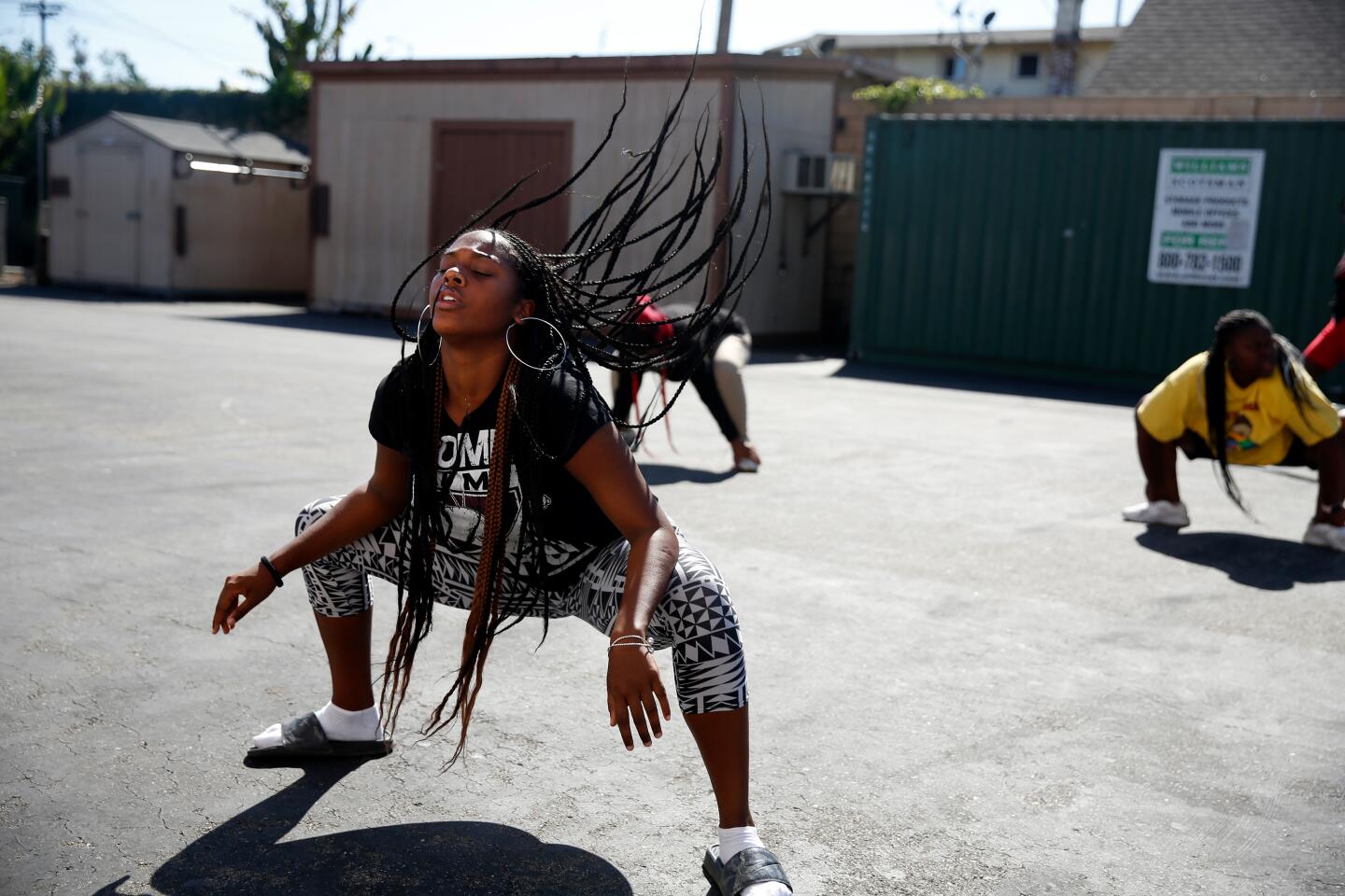 LOS ANGELES, CA-AUGUST 26, 2019: Kamryn Johnson dances with classmates after school on August 26, 2019 in Los Angeles, California. She is a student at ICEF View Park Prep Charter High School, across the street from the Marathon store where Nipsey Hussle was shot and killed earlier this year. (Photo By Dania Maxwell / Los Angeles Times)