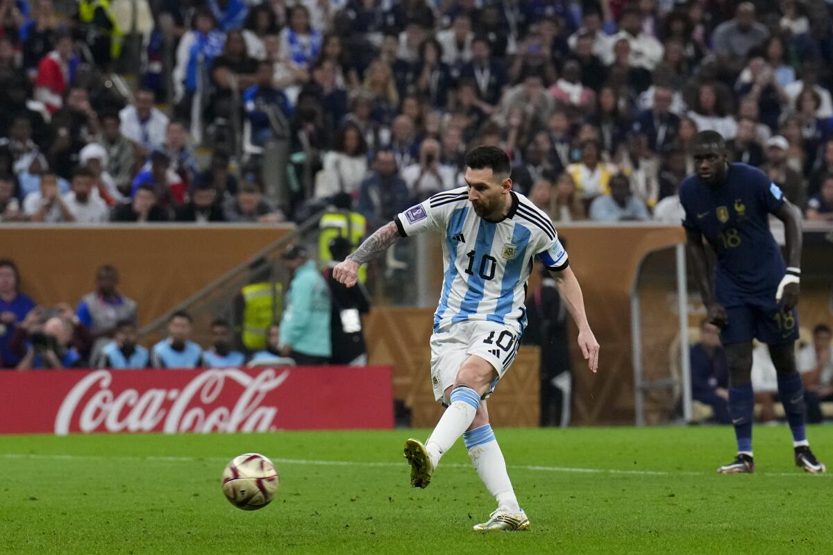 Argentina's Lionel Messi about to kick a soccer ball