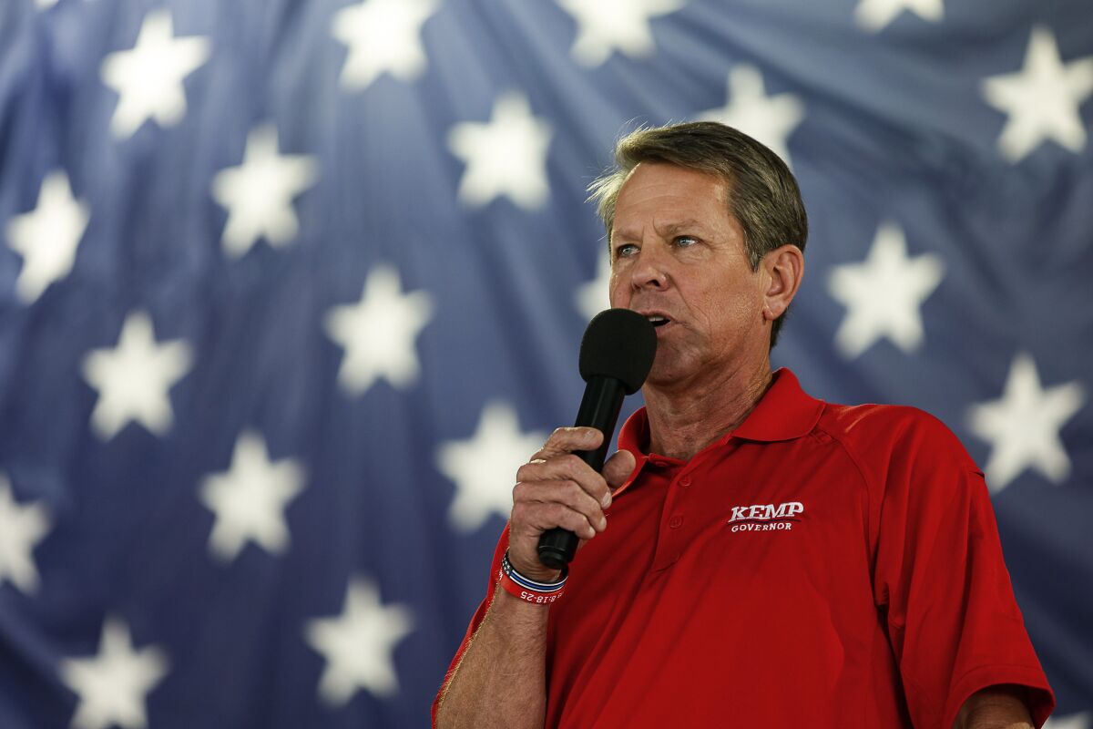FILE - Georgia Gov. Brian Kemp speaks during the 17th annual Floyd County GOP Rally at the Coosa Valley Fairgrounds on Saturday, Aug. 7, 2021 in Rome, Ga. Kemp is far outraising his main Republican primary challenger, former U.S. Sen. David Perdue, leaving Perdue with less than $1 million in cash on hand while Kemp had $12.7 million in his main campaign account. (Troy Stolt/Chattanooga Times Free Press via AP, File)