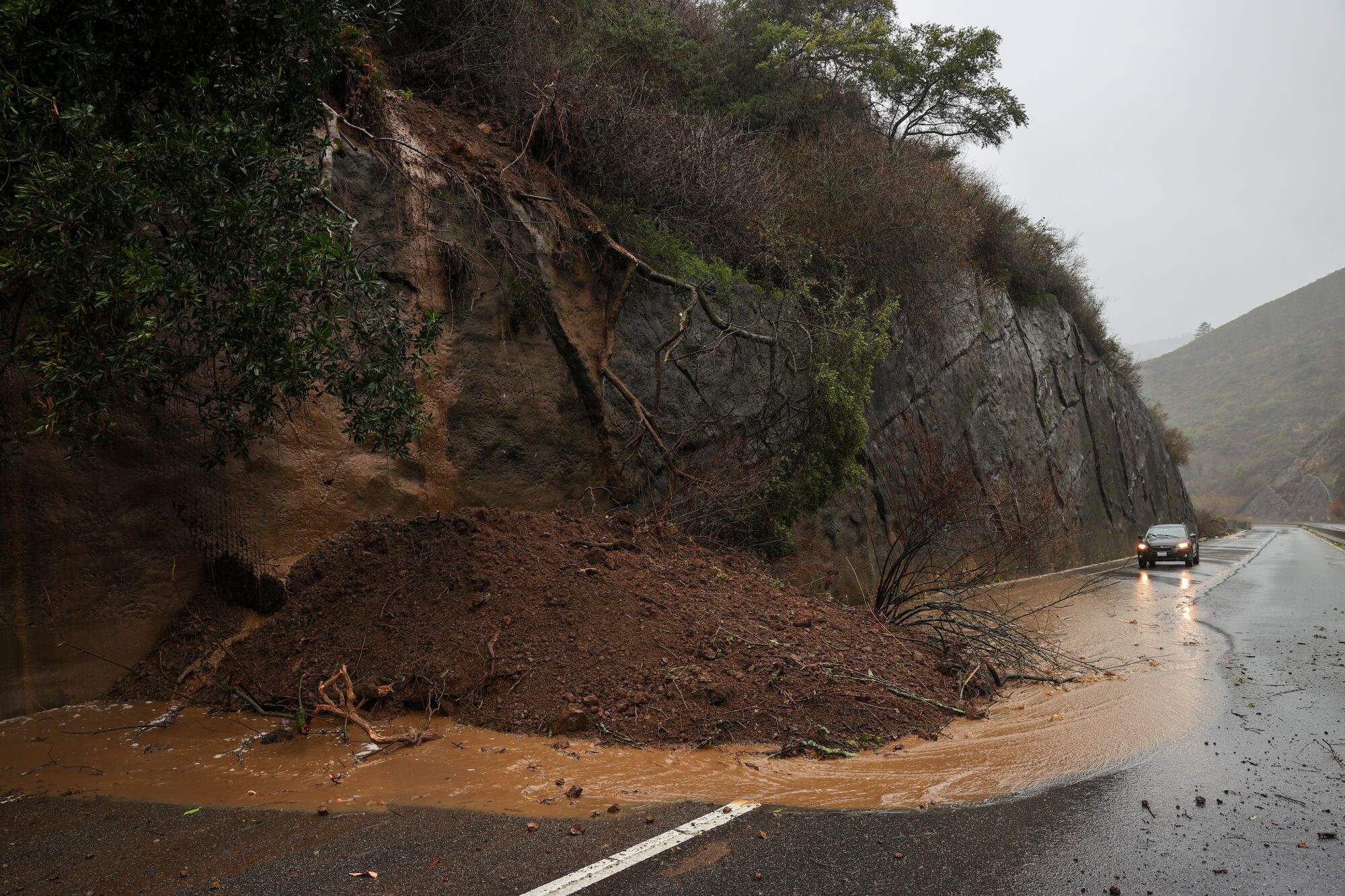 A landslide blocks one lane of Highway 92 West in San Mateo County.