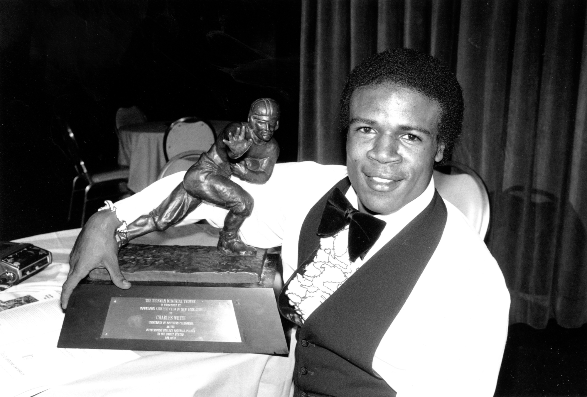 USC running back Charles White poses with the Heisman Trophy on Dec. 12, 1979, in New York.