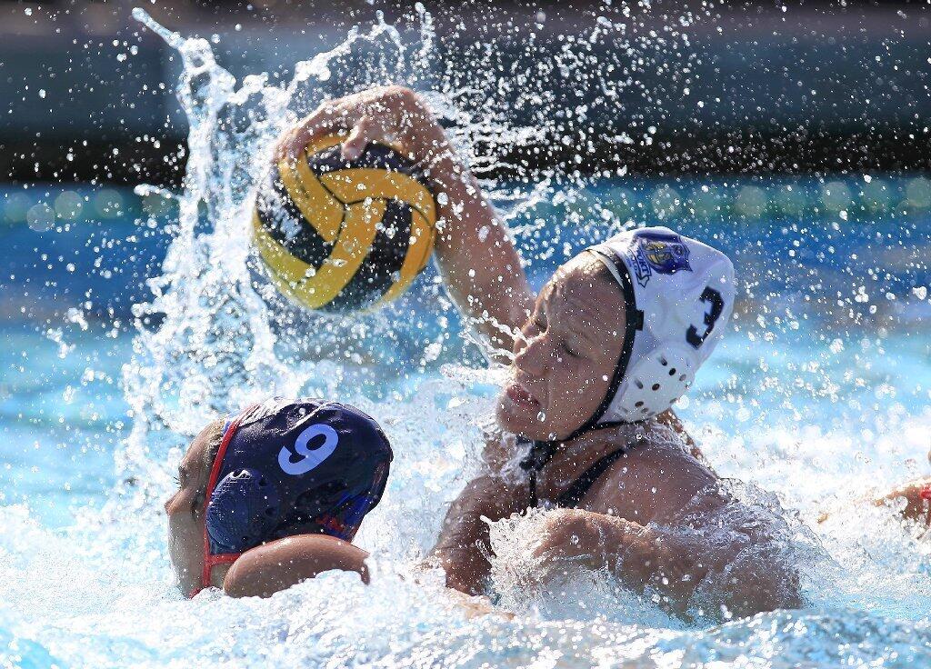Newport Water Polo Foundation's Chanel Schilling (3) battles inside against United Water Polo Club's Kayla Constandse (9) during the second half in a USA Water Polo Junior Olympics match at Capistrano Valley High in Mission Viejo on Thursday.