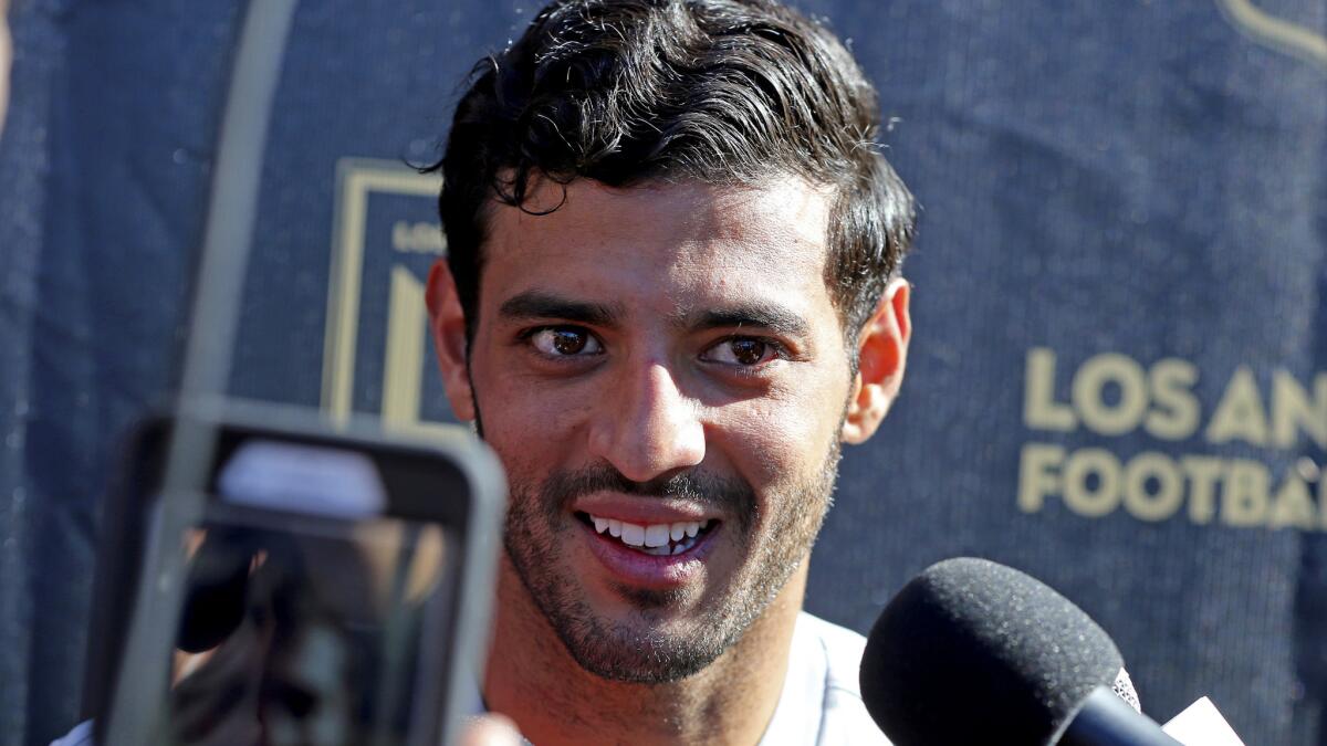Carlos Vela talks to reporters during the introduction of players and coaches at the first training camp of the Los Angeles Football Club MLS soccer team on the campus of UCLA on Monday, Jan. 22, 2018.