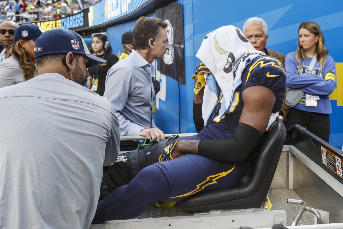 Chargers cornerback J.C. Jackson is taken by cart off the field after injuring his knee in October.