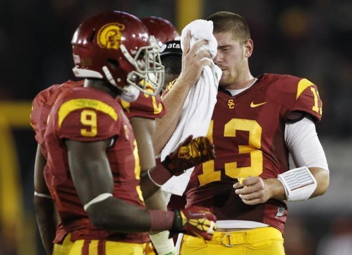 USC quarterback Max Wittek, right, wipes his face as wide receiver Marqise Lee stands nearby during a game in November.