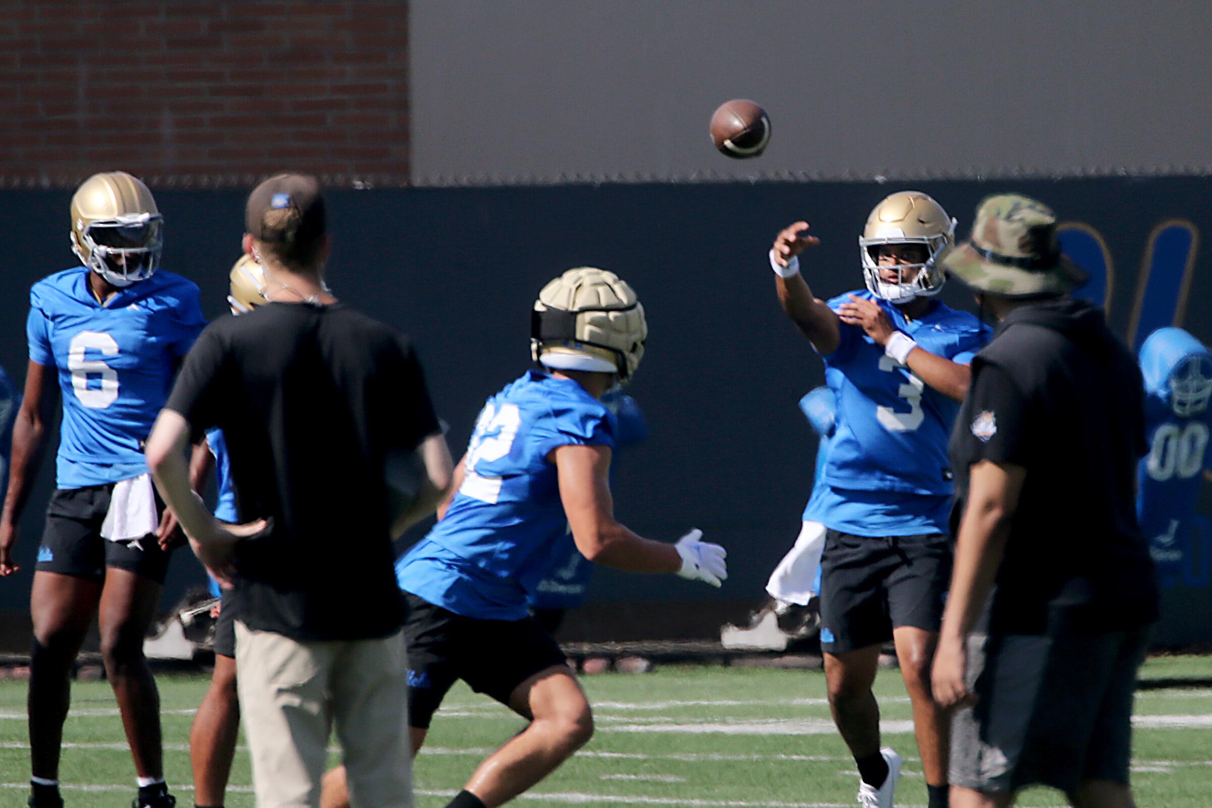 UCLA quarterback Dante Moore warms up during a practice session at Spaulding Field on the UCLA campus.
