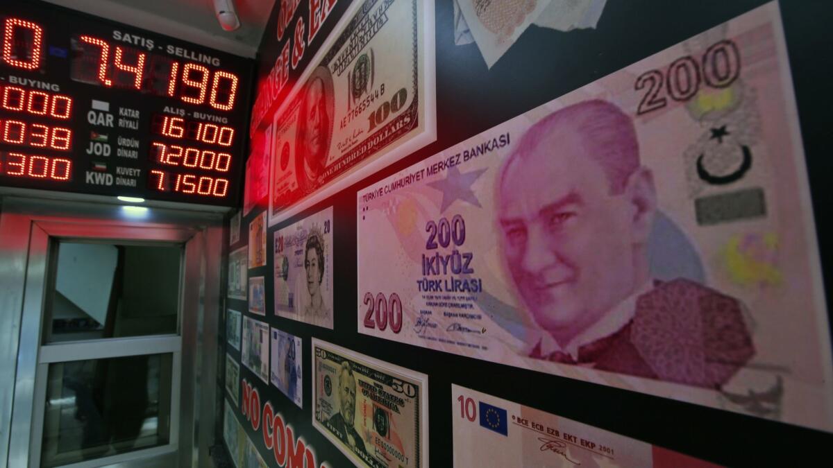 An oversized copy of a 200 Turkish lira banknote decorates a currency exchange shop in Istanbul.