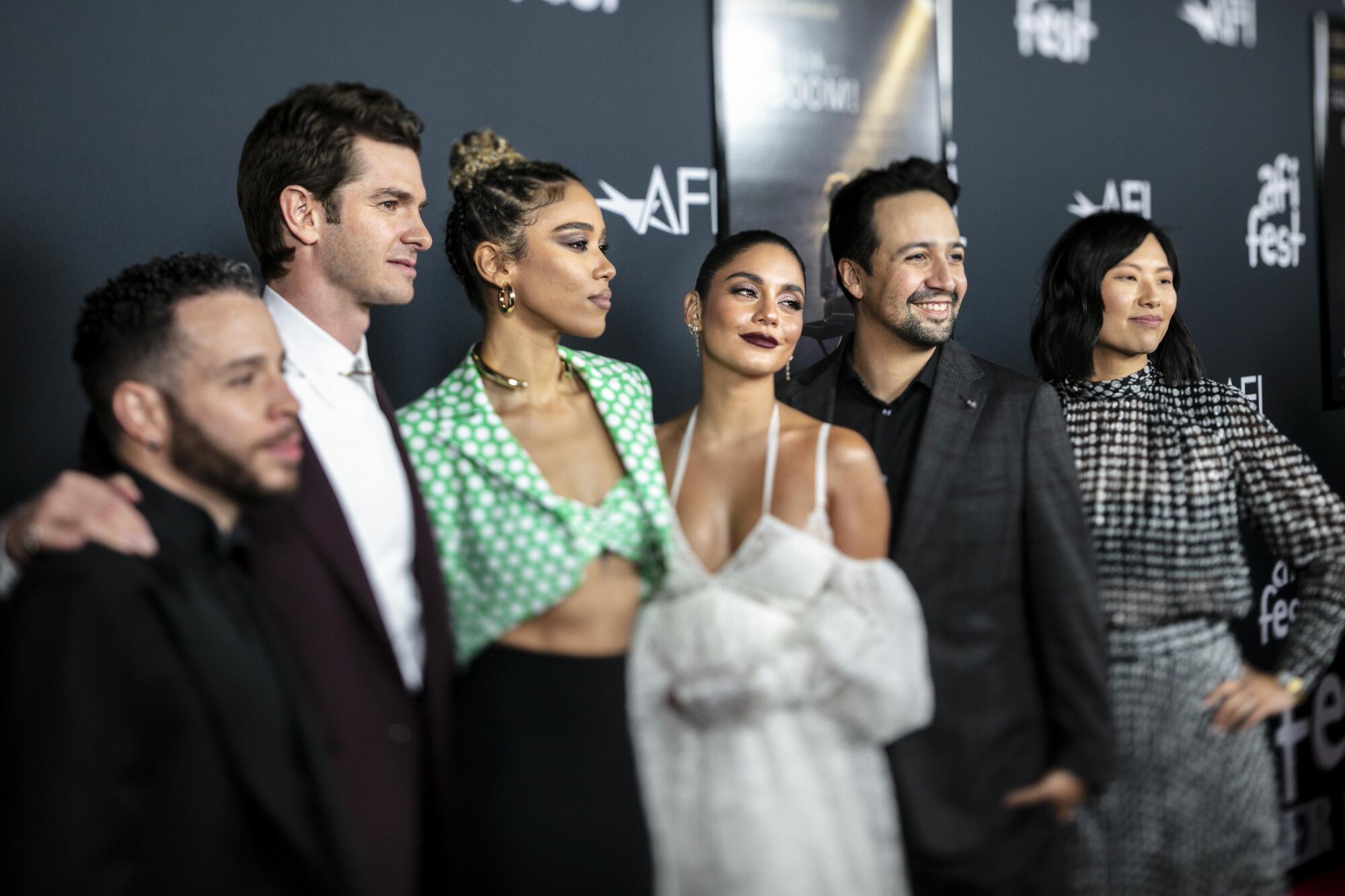 The cast and creative team of "Tick, Tick … Boom!" on a red carpet.