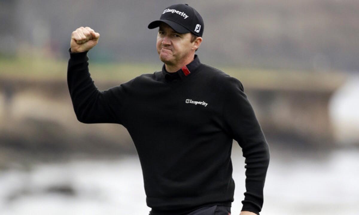 Jimmy Walker celebrates on the 18th green after winning the Pebble Beach Pro-Am on Sunday.
