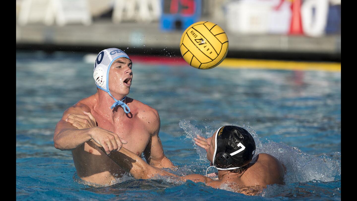 Corona del Mar's Mitchell Cooper takes a shot under pressure from Foothill's Samuel Harrison during the CIF Southern Section Division 2 championship game at Woollett Aquatics Center on Saturday, November 11.