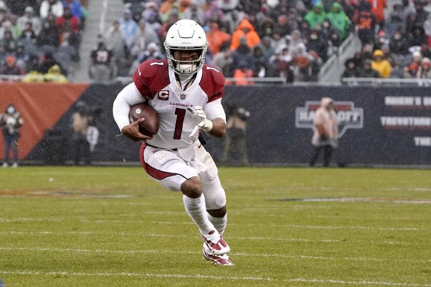 Arizona Cardinals quarterback Kyler Murray carries the ball during the first half of an NFL football game against the Chicago Bears Sunday, Dec. 5, 2021, in Chicago. (AP Photo/David Banks)