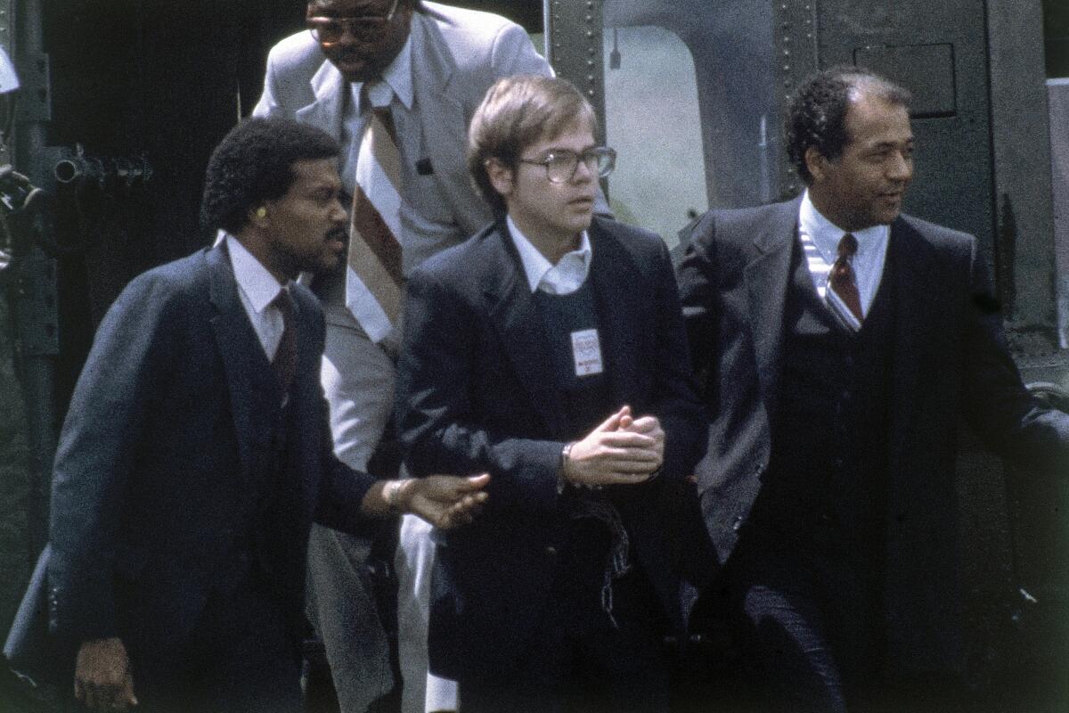 U.S. marshals escort John Hinckley Jr. in 1981. 