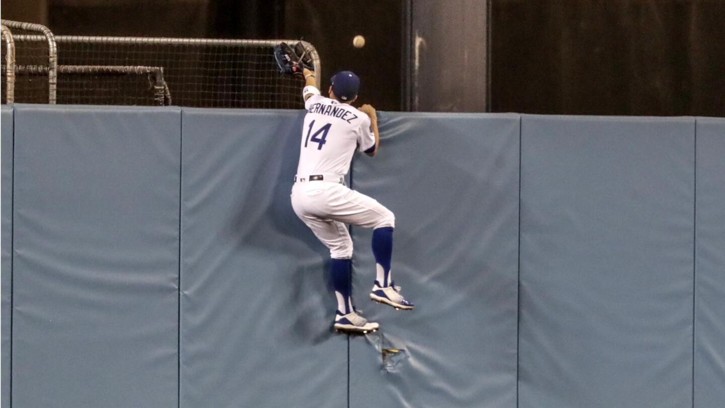 Dodgers center fielder Enrique Hernandez can't reach a J.D.Martinez homer in the seventh inning.