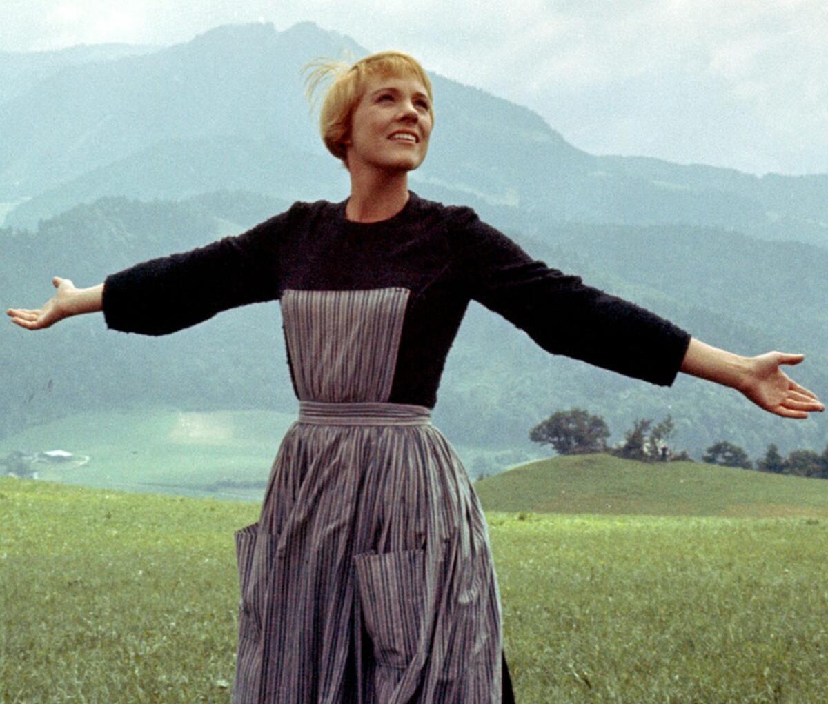Julie Andrews on a field high in the Alps in "The Sound of Music" (1965)