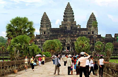Surrounded by a rectangle of long corbel-arched galleries, Angkor Wat rises in three astounding tiers to a cluster of five beehive-shaped towers, or prasats.