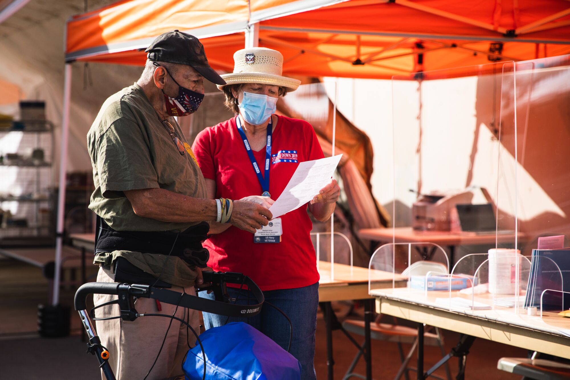 Nadirah Sahar (right) guides U.S. Marine veteran Ray Gomez to find potential employment during the “Stand Down” event.