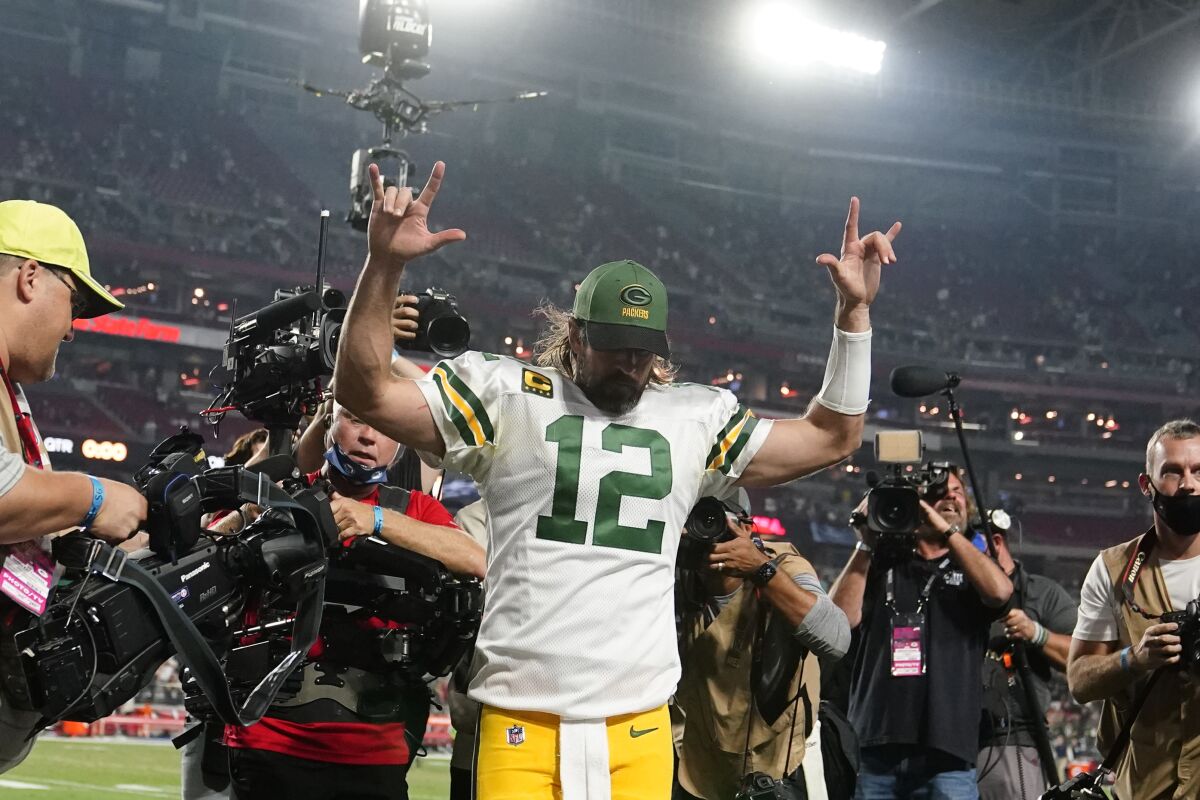 Green Bay Packers quarterback Aaron Rodgers (12) celebrates after an NFL football game against the Arizona Cardinals, Thursday, Oct. 28, 2021, in Glendale, Ariz. The Packers won 24-21. (AP Photo/Ross D. Franklin)